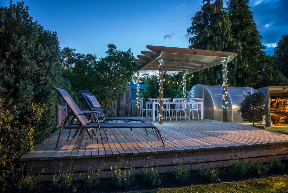 fairy lights on decking in a back garden