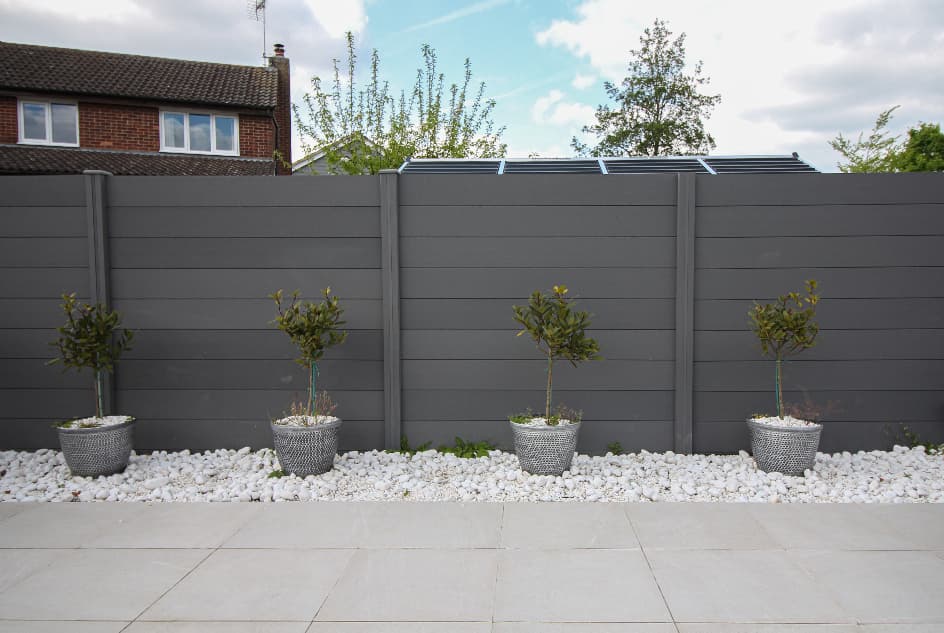 grey composite fencing in garden